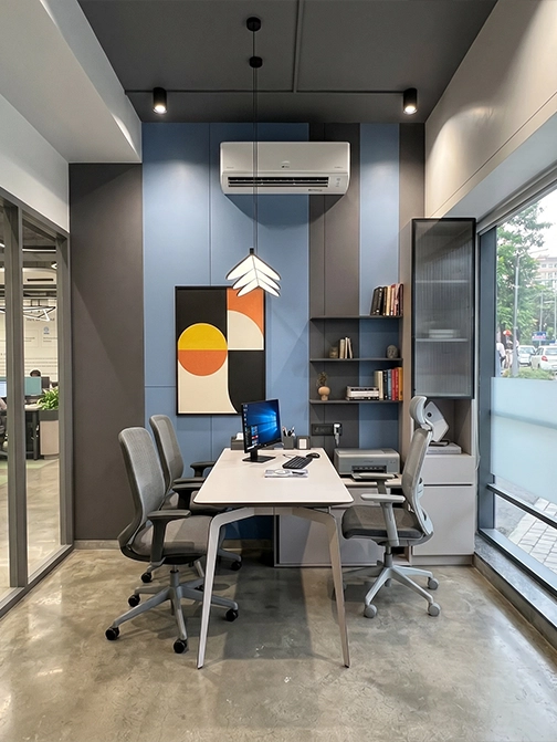 A considered financial-services workspace — biophilic detailing, controlled visitor sequence, disciplined finish allocation