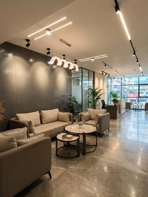 A considered financial-services workspace — biophilic detailing, controlled visitor sequence, disciplined finish allocation